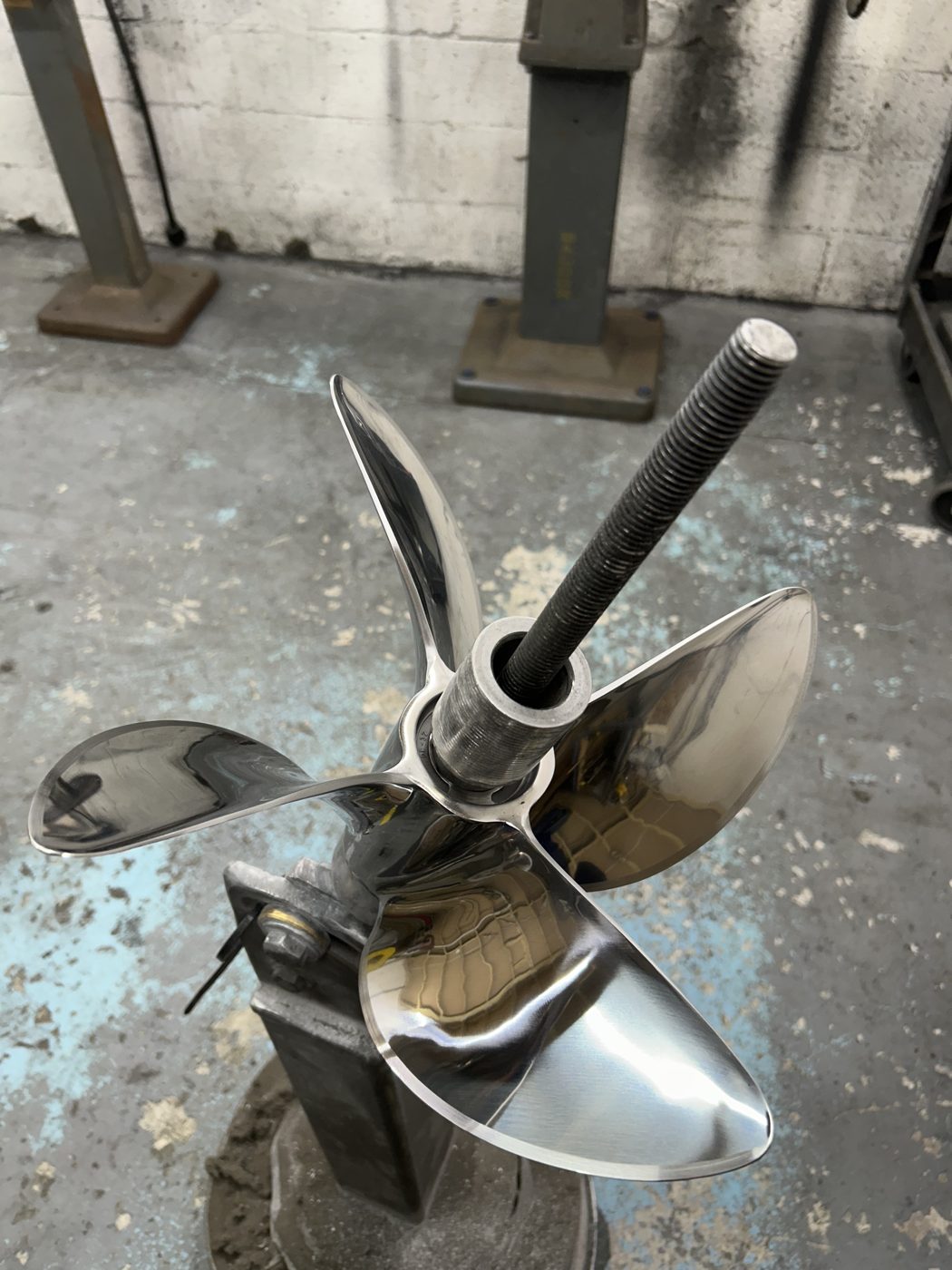 Mirror-polished stainless steel four-blade propeller finished at PropWorx, Fort Lauderdale FL