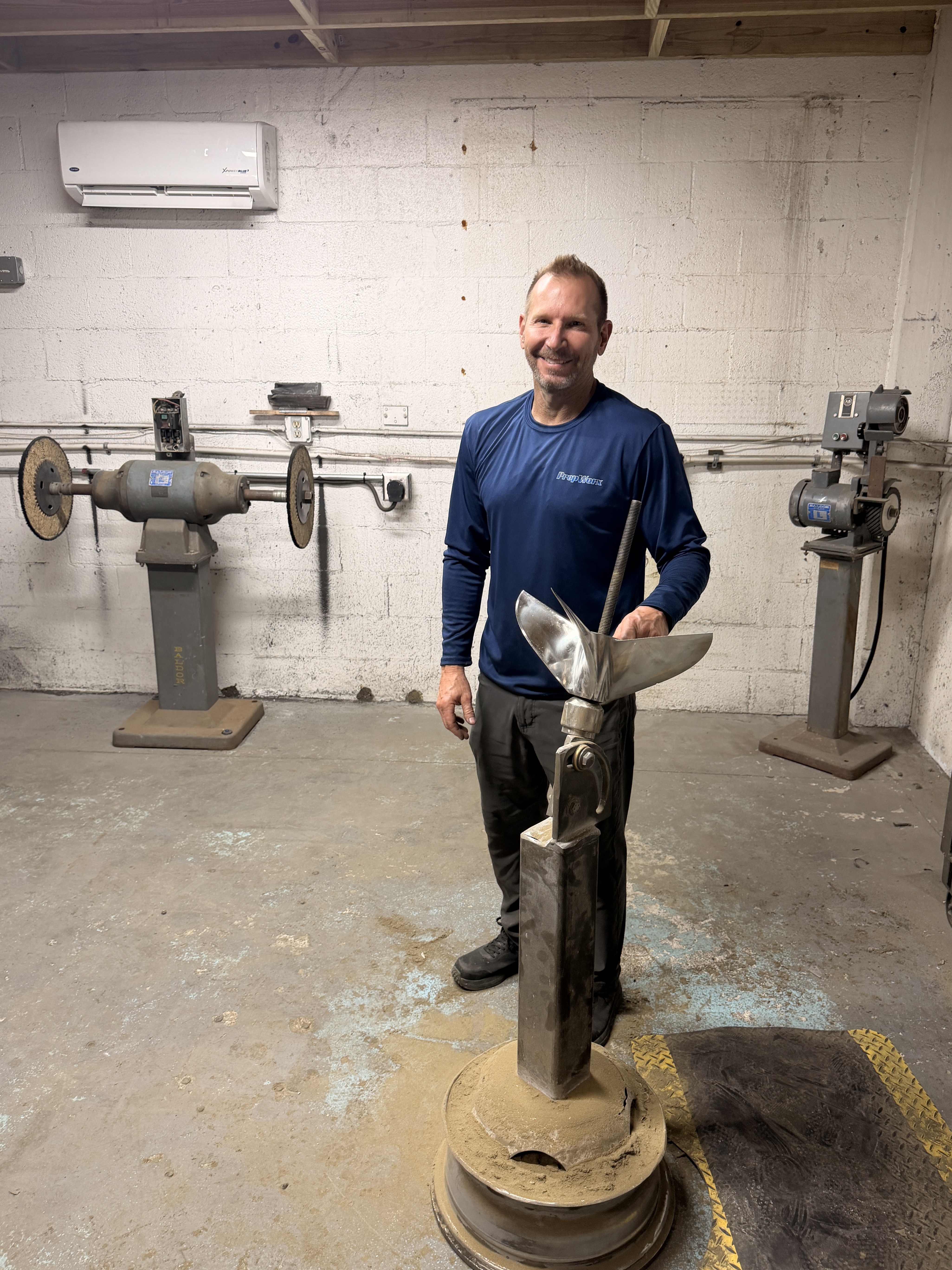 Mike Eggleston, owner of PropWorx boat propeller repair in Fort Lauderdale, FL, working on a propeller