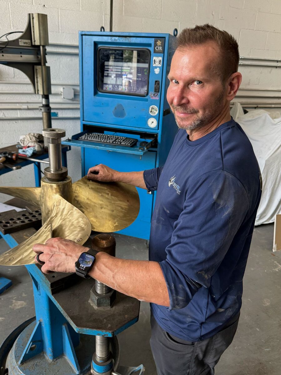 Mike Eggleston measuring a bronze inboard propeller on the MRI scanning system at PropWorx, Fort Lauderdale FL